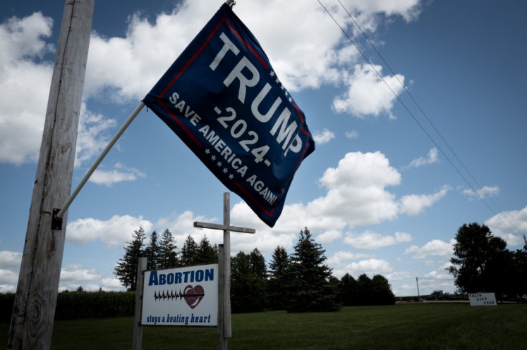 A farmer shows support for Republican presidential candidate former President Donald Trump and a view on abortion on August 10, 2024 near Hawkeye, Iowa. Trump won Iowa by 9 percent in 2016 and 8 percent in 2020 over his democratic rivals. A new Iowa law bans most abortions after about 6 weeks, before many women know they're pregnant.   