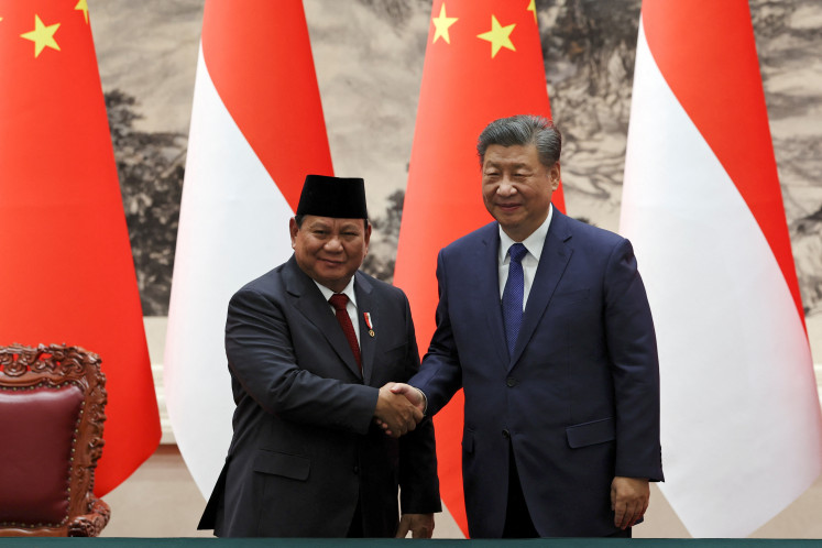 Chinese President Xi Jinping and Indonesian President Prabowo Subianto shake hands during a signing ceremony at the Great Hall of the People in Beijing, China, on Nov. 9, 2024.