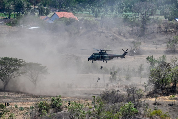 Indonesian Military (TNI) personnel rappel from an Air Force H-225 M Caracal helicopter during the Super Garuda Shield 2024 joint military exercise, held on Sept. 6, 2024, which included Indonesia, Japan, Singapore, Australia, the United Kingdom and the United States in Situbondo, East Java.