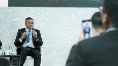 Pupuk Indonesia president director Rahmad Pribadi speaks at a panel discussion on Monday at the Indonesian Pavilion at the 29th UN Climate Change Conference (COP29) in Baku, Azerbaijan. Rahmad announced Pupuk Indonesia’s Green Ammonia Initiative from Aceh (GAIA). (Courtesy of Pupuk Indonesia)

