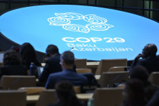 Participants listen to speeches during the United Nations climate conference (COP29) in Baku
on Nov. 13, 2024.