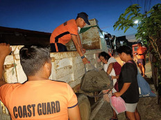 Philippine Coast Guard (PCG) personnel evacuate residents during an operation in Virac town, Catanduanes province, ahead of the arrival of Typhoon Many-yi on Nov. 15, 2024 in this handout photo released on Nov. 16. Philippine authorities ordered all vessels back to shore and people in coastal communities to leave their homes on November 16 as Typhoon Man-yi neared the storm-weary archipelago nation, with forecasters expecting it to intensify before making landfall.
