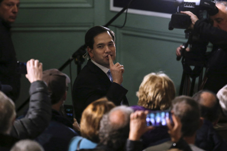 United States Senator from the Republican Party Marco Rubio asks his supporters to be quiet as he attempts to conduct a TV interview before a campaign rally in Exeter, New Hampshire, the United States on Feb. 2, 2016.
