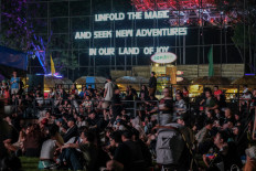 A magical weekend: Festivalgoers sit on the ground as they wait for a performer to come onstage during the 2024 Joyland Festival in Senayan, Central Jakarta, on Nov. 23, 2024.