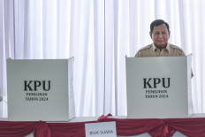 President Prabowo Subianto stands at a voting booth for the 2024 regional elections at a polling station in Bojong Koneng village, Bogor regency, West Java, on Nov. 27, 2024. Indonesia is holding simultaneous elections in 37 provinces and more than 500 cities and regencies across the country to elect new regional heads.