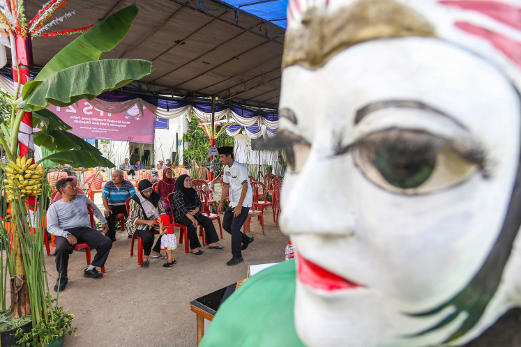 Voters wait to cast their votes in the 2024 simultaneous regional elections on Nov. 27, 2024, at a polling station in Cipinang Melayu subdistrict, East Jakarta. Jakarta was one of 37 provinces holding simultaneous regional head elections.