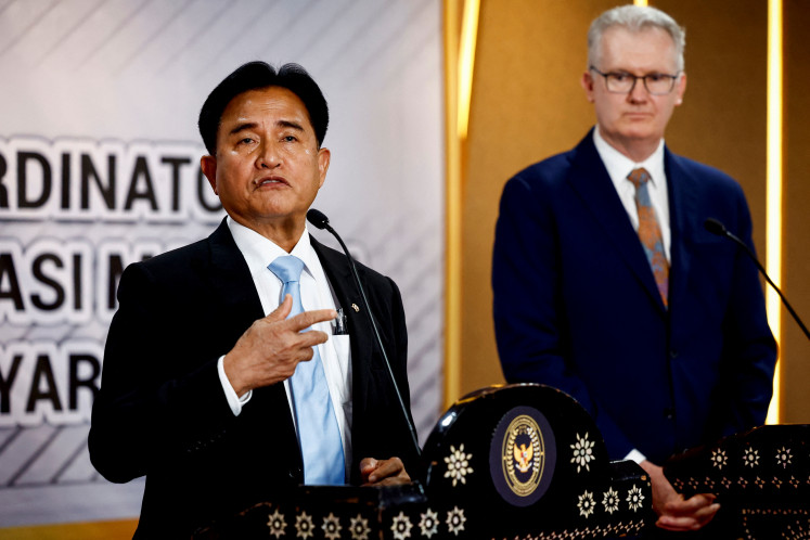 Indonesia's Chief Minister for Law and Human Rights, Yusril Ihza Mahendra, speaks as Australia's Minister for Home Affairs, Tony Burke, listens during a press conference following their meeting in Jakarta, Indonesia, on Tuesday, December 3, 2024. 