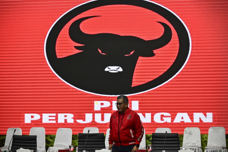 Indonesian Democratic Party of Struggle (PDI-P) secretary-general Hasto Kristiyanto walks to the table ahead of a press briefing from the party about the 2024 regional head elections in Jakarta on Nov. 20, 2024.