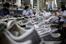 Employees work at a shoe factory for export in Hanoi on Dec. 29, 2020. 