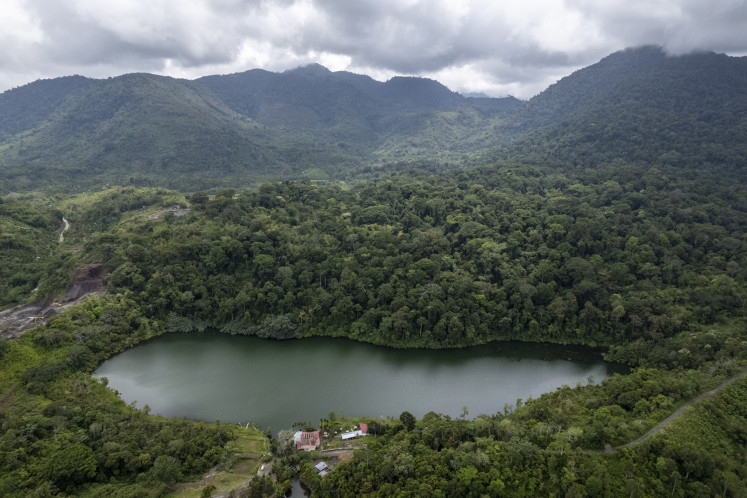 An aerial photo shows Lingkat Lake in Kerinci regency, Jambi on Nov. 18, 2024. The lake is located in the Lekuk 50 Tumbi Lempur customary forest that has become a tourist destination visted by 6,000 visitors every year.