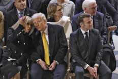 French first lady helps keep Trump, Bidens apart at Notre Dame