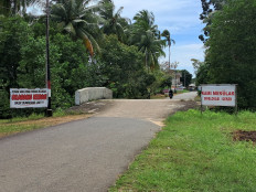 Staying put: Protest signs are pictured on Tuesday, December 5, 2024, on the outskirts of Sembulang village on Rempang Island, where a glass and solar panel manufacturing site is to be constructed. Set up by a group of villagers resisting eviction for the industrial project, the signs reads: “To those who have accepted relocation: You are strictly prohibited from coming back to Sembulang!!!”.