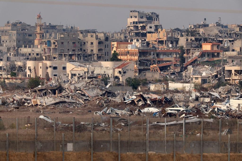 A picture taken from Israel's southern border with the Gaza Strip on December 11, 2024, shows destroyed buildings inside the Palestinian territory, amid the ongoing war between Israel and the militant group Hamas.