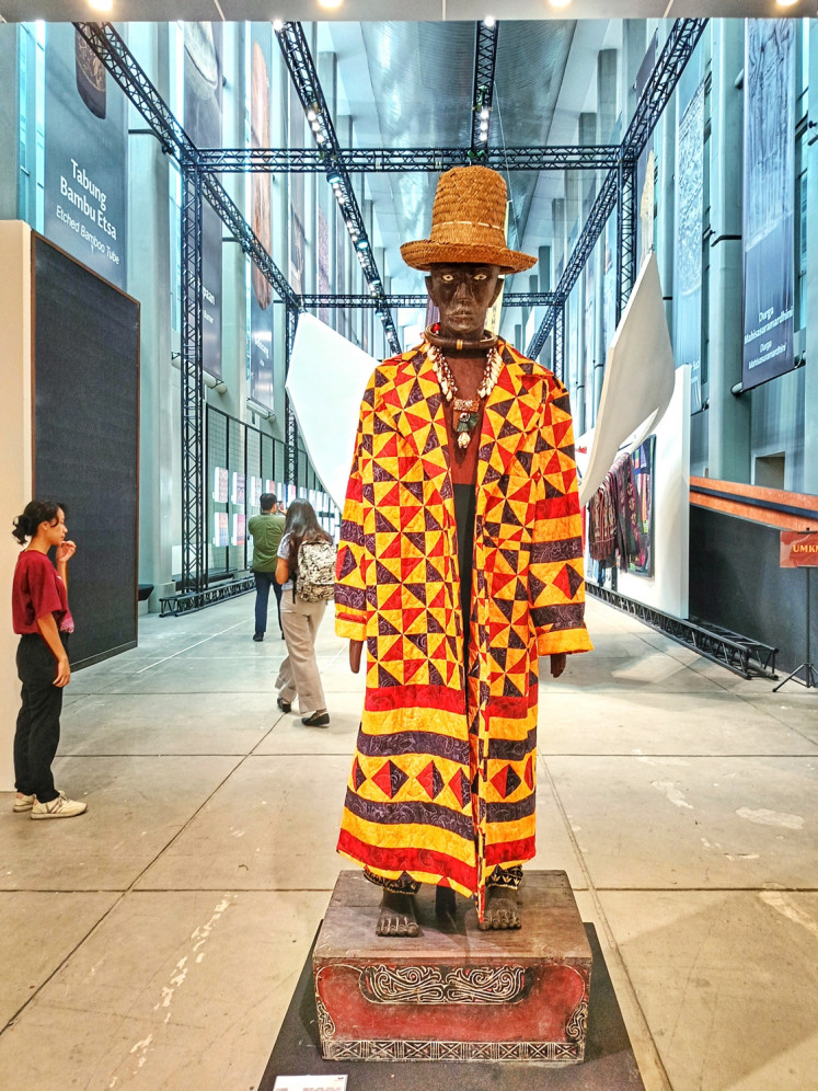 A Batak sigale-gale puppet, dressed in a sacred priest's jacket crafted from Batak Mandailing ulos with intricate patchwork designs, is displayed during “The Flying Cloth” handwoven textile exhibition at the National Museum.