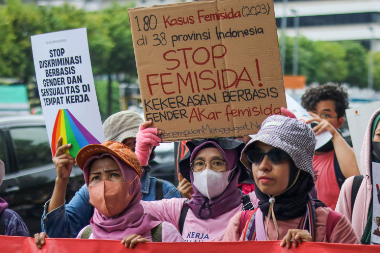 Activists hold some banners during a peaceful demonstration against gender-based violence in Jakarta on Nov. 25, 2024. The protesters urge the government to push the resolution for cases of gender-based violence and protection for women.