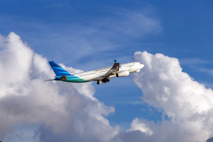 Soaring: A Garuda Indonesia aircraft takes flight in this undated photograph.

