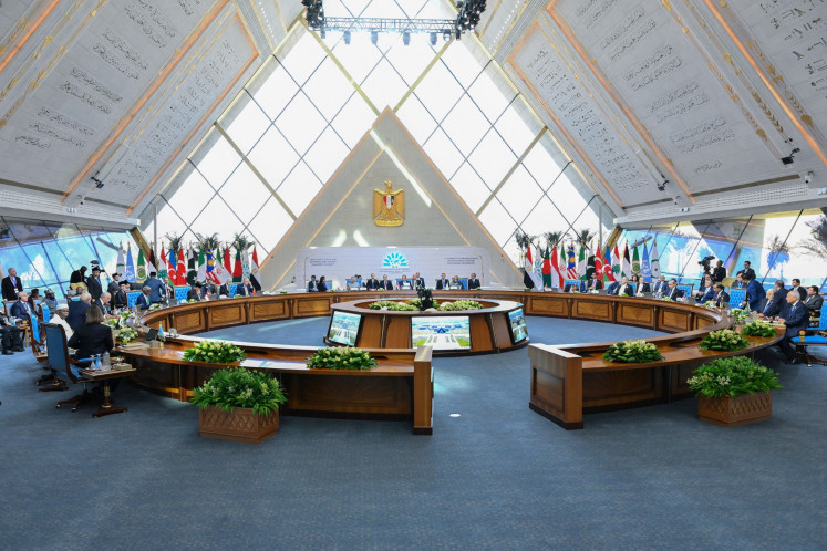 Leaders of Bangladesh, Egypt, Iran, Malaysia, Nigeria, Pakistan and Turkey meet on Dec. 19, 2024, at the D8 summit in Cairo.  