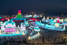 An aerial view shows people visiting the Harbin Ice and Snow World Festival in Harbin, northeast China's Heilongjiang province, on Dec. 21, 2024.
