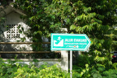 A new sign for a tsunami evacuation route is seen on Dec. 9, 2024, on one of Aceh’s main roads.