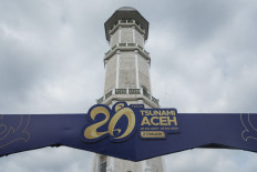 The decoration for the 20th anniversary of the 2004 Indian Ocean earthquake and tsunami stands in front of the main minaret of the Baiturrahman Mosque in Banda Aceh, Aceh on Dec. 25, 2024, the eve of the disaster's anniversary. On Dec. 26, 2004, a magnitude 9.1 earthquake struck the coast of Sumatra Island and triggered a huge tsunami across the Indian Ocean that killed more than 220,000 people in a dozen countries.