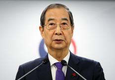 South Korea Prime Minister and acting President Han Duck-soo speaks in his address to the nation at the Government Complex in Seoul on December 26, 2024. 