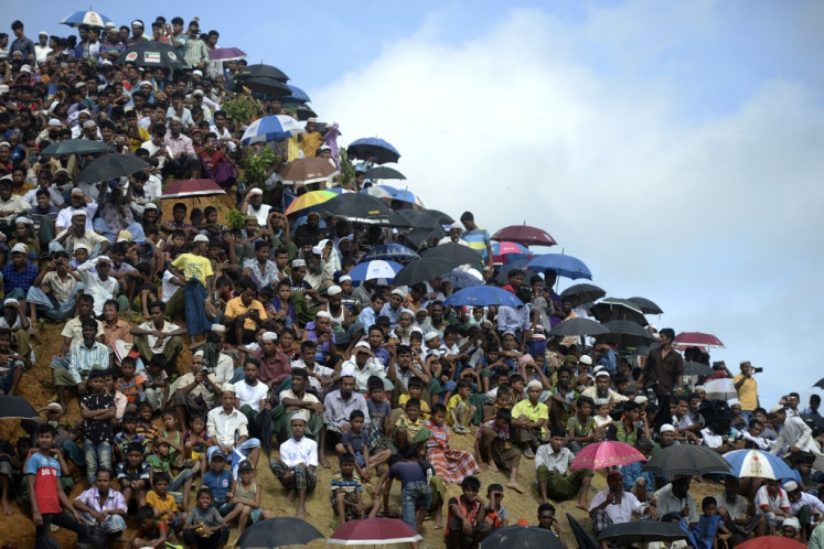 Rohingya refugees attend a ceremony organized to remember the second anniversary of a military crackdown that prompted a massive exodus of people from Myanmar to Bangladesh at the Kutupalong refugee camp in Ukhia on Aug. 25, 2019.