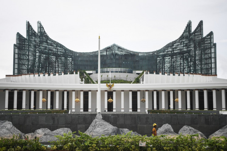 A worker walks in front of the State Palace on Nov. 10, 2024, at the government offices complex in the future capital Nusantara in North Penajam Paser, East Kalimantan. 