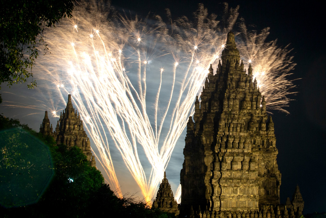 Fireworks light up above Prambanan Temple, a 9th-century Hindu temple complex and UNESCO World Heritage Site, in Yogyakarta on Jan. 1, 2024.