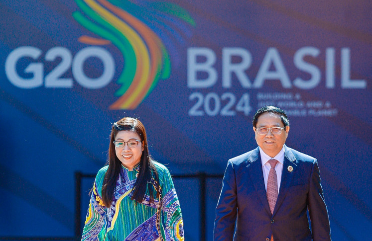 Delicate diplomacy: Vietnam's Prime Minister Pham Minh Chinh and his wife Le Thi Bich Tran arrive at the Modern Art Museum (MAM) to attend the first session of the G20 Leaders' Meeting in Rio de Janeiro, Brazil, on Nov. 18, 2024. 