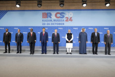 (From left to right) Ethiopia's Prime Minister Abiy Ahmed, Egypt's President Abdel Fattah al-Sisi, South Africa's President Cyril Ramaphosa, China's President Xi Jinping, Russia's President Vladimir Putin, India's Prime Minister Narendra Modi, UAE President Sheikh Mohammed bin Zayed al-Nahyan, Iran's President Masoud Pezeshkian, and Brazil's Foreign Minister Mauro Vieira pose for a family photo during the BRICS summit in Kazan, Russia on Oct. 23, 2024.
