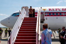 On the move: President Prabowo Subianto (top, center) gestures to Malaysian Prime Minister Anwar Ibrahim (bottom, right) upon boarding the presidential plane for a flight to Jakarta at the Kuala Lumpur International Airport in Malaysia, on Jan. 9, 2025. Prabowo traveled to Kuala Lumpur to discuss with Anwar about various bilateral and regional issues.