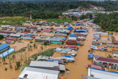 Houses partially submerged in flood water after the Kobe River overflowed following heavy rains are seen in Lukulamo, North Maluku, on July 22, 2024.