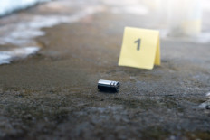 An illustration of a bullet casing in a crime scene.