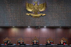 Game changer: Constitutional Court Chief Justice Suhartoyo (center), accompanied by his deputy, Justice Saldi Isra (second left), Justice Enny Nurbaningsih (left), Justice Arief Hidayat (second right) and Justice Guntur Hamzah, presides over a hearing in Jakarta on Jan. 2, 2025. 