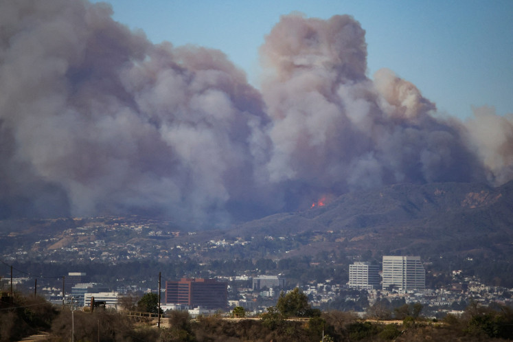 Smoke rises from a wildfire burning near Pacific Palisades on the west side of Los Angeles during a weather driven windstorm in Los Angeles, California, the Untied States, on Jan. 7, 2025.