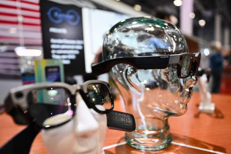 The Xander glasses for real-time offline captioning of conversation audio for the hearing impaired is displayed during the Consumer Electronics Show (CES) in Las Vegas, Nevada, the United States, on Jan. 7, 2025. Gadgets, robots and vehicles imbued with artificial intelligence will once again vie for attention at the CES, as vendors behind the scenes will seek ways to deal with tariffs threatened by US President-elect Donald Trump. The annual Consumer Electronics Show (CES) opens formally in Las Vegas on Jan. 7, 2025, but preceding days are packed with product announcements.