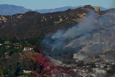 Los Angeles fires expand as winds forecast to pick up