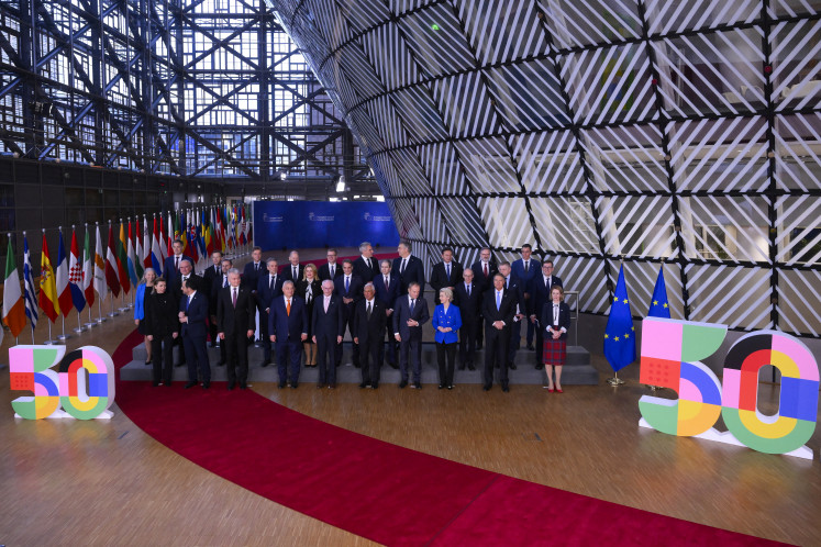 All together now: Members of the European council pose for a family picture following a meeting at the EU headquarters in Brussels on Dec. 19, 2024.