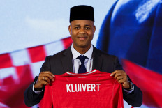 Newly appointed Indonesian national soccer team head coach Patrick Kluivert poses for pictures during a press conference in Jakarta, Indonesia, on Monday, January 12, 2025. 