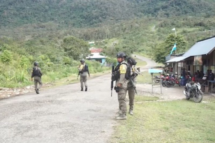 Police officers from Operation Cartenz Peace patrol in Bintang Highlands regency, Papua Highlands, on Sept. 21, 2023. The operation aims to quell the Free Papua Movement (OPM).