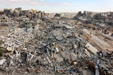This elevated view shows mounds of rubble from collapsed buildings along Saftawi Street in Jabalia in the northern Gaza Strip on Jan. 20, 2025 a day after a ceasefire deal in the war between Israel and Hamas went into effect.

