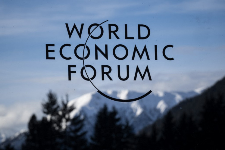 A sign of the World Economic Forum (WEF) with mountains in the background on Jan. 20, 2025, ahead of the WEF annual meeting in Davos, Switzerland.
