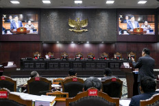Constitutional Court Chief Justice Suhartoyo (fourth left) presides over a 2024 election dispute hearing on April 4, 2024, in Jakarta.