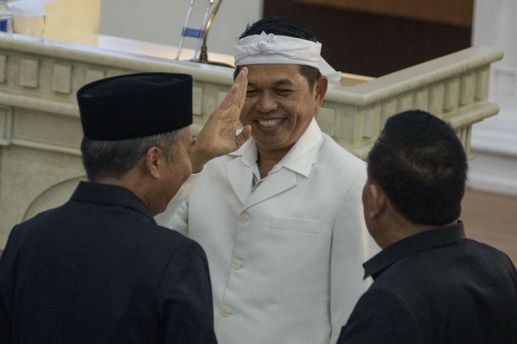 West Java governor-elect Dedi Mulyadi (center) salutes after a plenary meeting at the West Java Council building to announce the result of the province's regional head elections on Jan. 10.