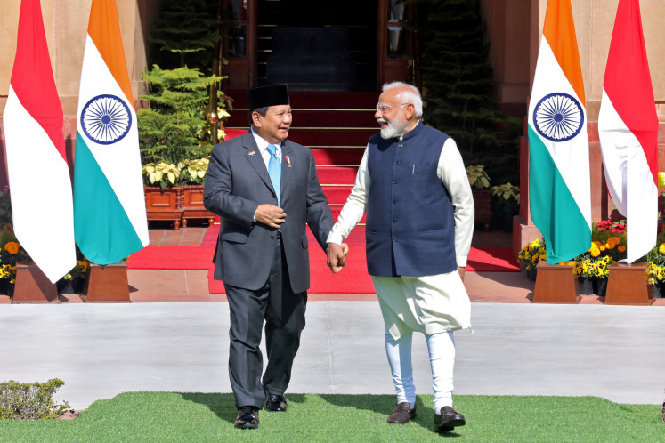 President Prabowo Subianto and Indian Prime Minister Narendra Modi hold hands on Jan. 25, 2025, as they arrive for a pre-meeting photo-op at Hyderabad House in New Delhi.