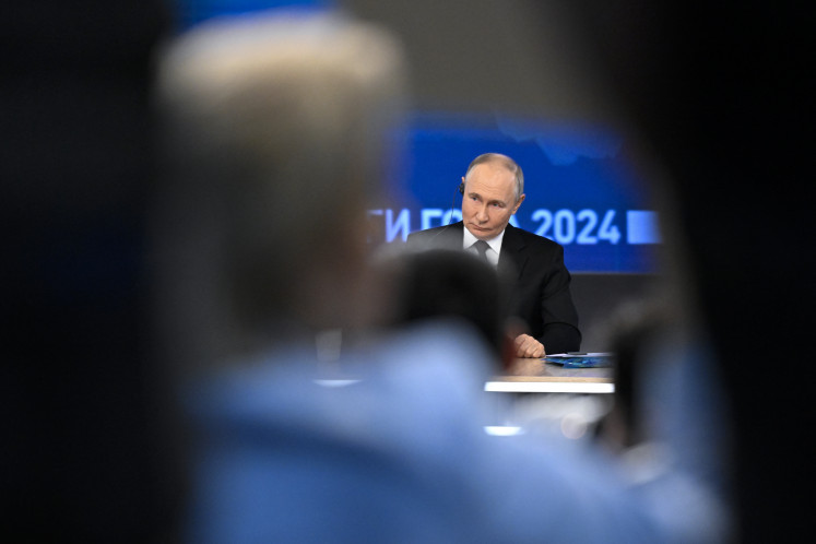 Russian President Vladimir Putin holds his annual end-of-year press conference in Moscow on Dec. 19, 2024.