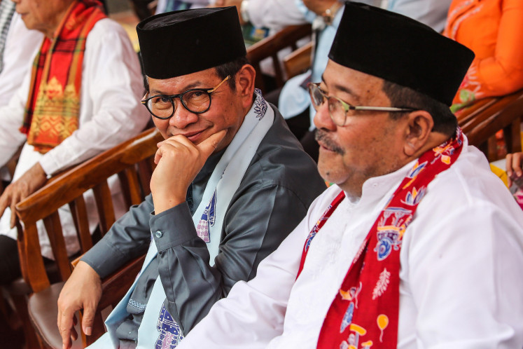 Big task: Jakarta governor-elect Pramono Anung (left) and deputy governor-elect Rano Karno (right) attend the Rawa Belong milkfish festival in Jakarta on Jan. 28, 2025. Jakarta residents’ hope for a sustainable less-polluted sky may rest with the city’s new leaders, who will step into office in the coming week.
