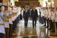 Defense Minister Sjafrie Sjamsoeddin (right) and his French counterpart Sebastien Lecornu (left) walk on Jan. 31, 2025, after a meeting at the Defense Ministry building in Jakarta.