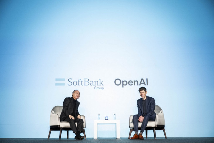 SoftBank group chairman and CEO Masayoshi Son (left) and OpenAI CEO Sam Altman attend a talk session in Tokyo on Feb. 3, 2025.