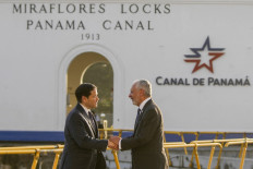 US Secretary of State Marco Rubio (L) shakes hands with Panama Canal Authority Administrator Ricaurte Vasquez during a tour at the Miraflores locks of the Panama Canal in Panama City on February 2, 2025. 
